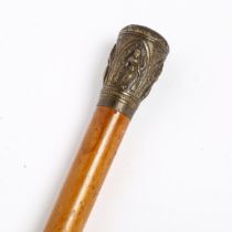 An Indian Malacca walking cane, with unmarked white metal knop, length 90cm Knop has a pushed in top