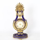 A replica Marie-Antoinette clock from the Victoria & Albert museum, gilded blue glaze porcelain in