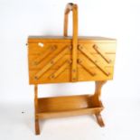 A teak cantilever sewing box