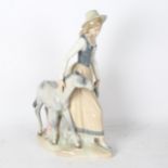 A Spanish porcelain group of a girl with a foal, height 40cm