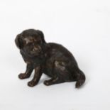 A small patinated bronze figural dog sculpture, indistinctly signed, height 6cm