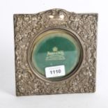 An Edward VII silver-fronted photo frame, by Mappin & Webb Ltd, with allover acanthus leaf and