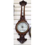 BALOM & COMPANY LONDON AND EDINBURGH - a Victorian carved oak-framed aneroid barometer, length 95cm