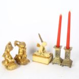 Brass candlesticks, pair of gilded cherubs, and a cherub box