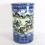 A reproduction Oriental umbrella stand, with blue and white decoration, countryside scene, height