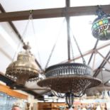 A silver plated hanging light fitting, and a modern pierced metal and wicker pendant light