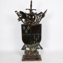 A mid-20th century iridescent cast-iron Sexton Shield fire companion set, comprising stand, sword