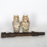 An Oriental carved hardwood flute with mask designs, length 35cm, pair of Oriental vases and a teddy