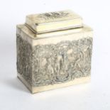 A decorative silver plated tea caddy, with embossed dancing figure decoration