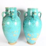 A pair of large Hamadan turquoise glaze pottery oil jars (1 A/F), height 54cm