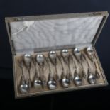A cased set of 12 Dutch silver teaspoons, with figural knops, original fitted case