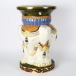 An Oriental ceramic garden seat with elephant support, 47cm