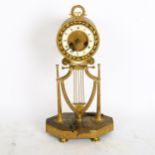 An 8-day brass drum clock, dial is Roman numerals and in A/F condition, height 34cm