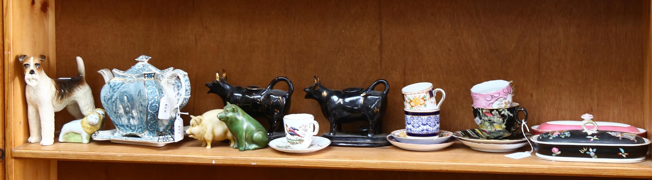 2 Jackfield cow creamers, a Terrier, a Victorian teapot and cover on stand , cabinet cups and