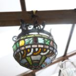 A Tiffany style cast-iron and coloured leadlight pendant light fitting