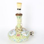 An enamel table lamp with floral decorated panels, height 37cm overall