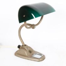 An Art Deco aluminium student's desk lamp, with green glass swivel shade, height 35cm No damage or