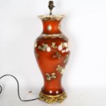 A large Oriental table lamp on cast-brass stand, with painted and gilded floral decoration, height