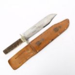 A staghorn-handled bowie knife, by George Wostenholm & Son, with leather sheath, blade length 25cm