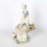 Lladro figure of a seated girl, 25cm