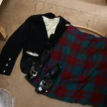 A Scottish tartan kilt, jacket, waistcoat and shoes Tartan kilt - no maker's marks or sizes. Several