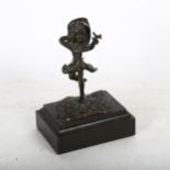 Bronze figure of a girl and bird, on wooden plinth, 13cm overall