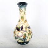 A Moorcroft vase with tube-lined floral decoration, height 16cm, boxed