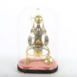 A reproduction brass skeleton clock in Gothic architectural design, striking on a bell, under