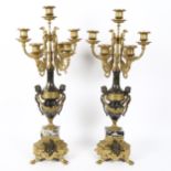 A pair of Louis XVI style Italian bronze and marble 7-light table candelabra, with cherub