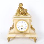 A marble and gilt-metal mantel clock, surmounted by a cherub, height 29cm