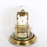 A glass domed 8-day mantel clock, made from brass, height including dome 24cm