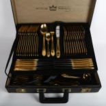 BESTECKE SOLINGEN - a canteen of gold plated cutlery for 12 people, including servers, in fitted