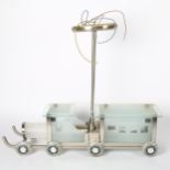 Unusual table lamp, modelled as a frosted glass train with metal mounts, length 55cm