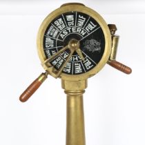 A ship's engine order telegraph, brass frame with oil lantern mount and working handles, height