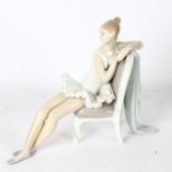 Lladro sculpture of a ballerina resting on a chair, height 24cm