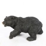 A patinated bronze figural grizzly bear sculpture, unsigned, length 30cm, height 21cm