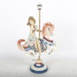 Lladro porcelain group, girl riding a carousel horse, 38cm (damage to flower petals)