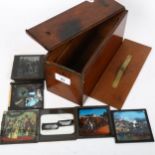 An Antique mahogany magic lantern slide case and 8 various slides