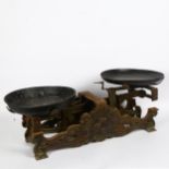 An Antique set of cast-iron balance scales, with relief cockerel motif, width 62cm