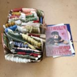 A large collection of upholstery fringing and edging, and 4 reproduction tin signs