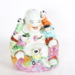 A Chinese famille rose laughing Buddha, with 5 figures of children, height 26cm