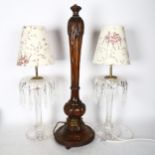A carved wood table lamp, 62cm, and a pair of table lamps with lustre drops