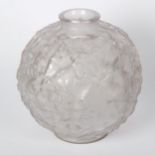 A moulded glass vase of globular form, with grapevine decoration