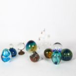 A group of paperweights, including Mdina