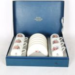 A boxed set of Royal Worcester coffee cans and saucers