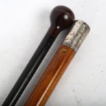 A Malacca walking cane with white metal top, and an ebonised cane, longest 113cm (2)