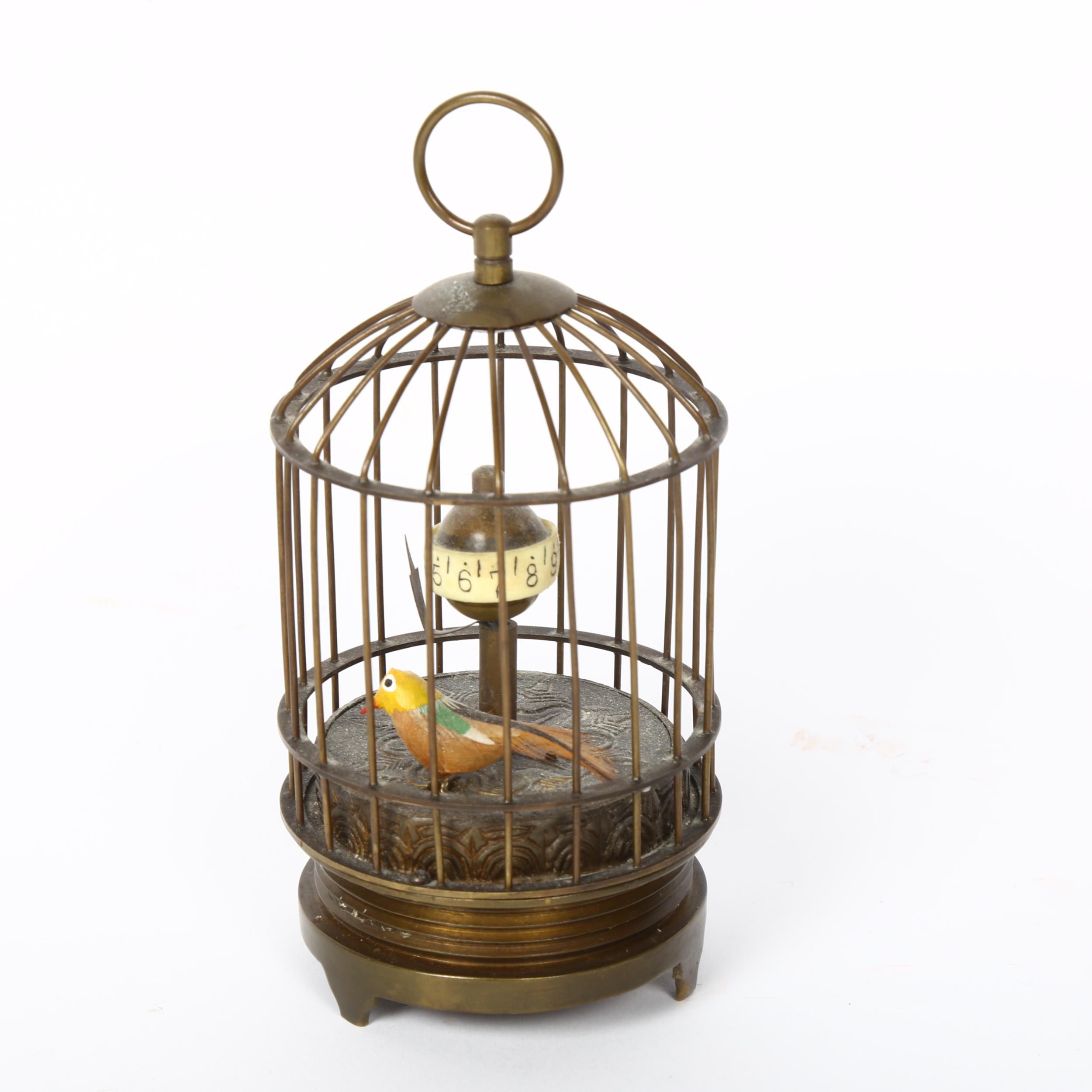 A small reproduction brass bird cage automaton clock, height 12cm, not currently working