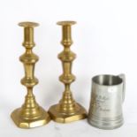 A pair of brass candlesticks, and a pewter jug, jug inscribed 1st V.V.V Regiment V. Company 1899 won