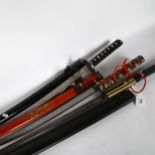 A reproduction set of 3 graduated Samurai swords, to include a Wakizashi and others