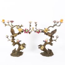 A pair of Art Nouveau French bronze and porcelain 'birds on branch' sculptures, with hand painted